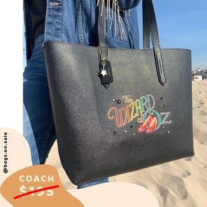 COACH Box Program Wizard Of Oz Cross Black Gold